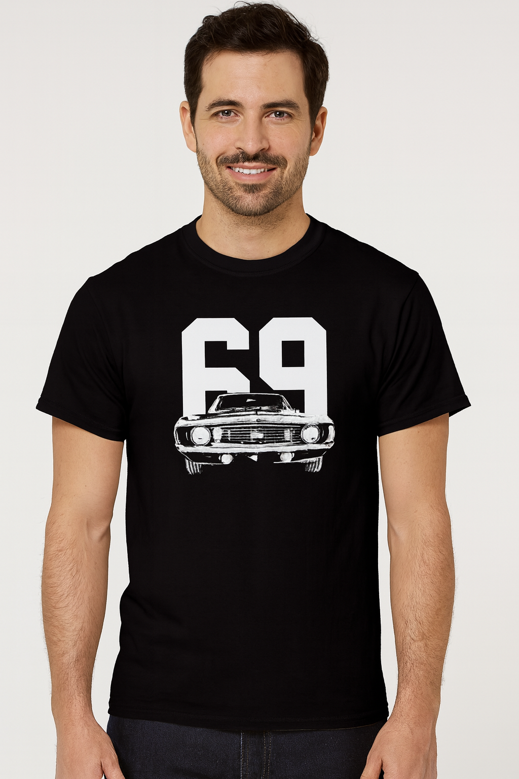 Man wearing a black t-shirt with a white graphic design on a plain background