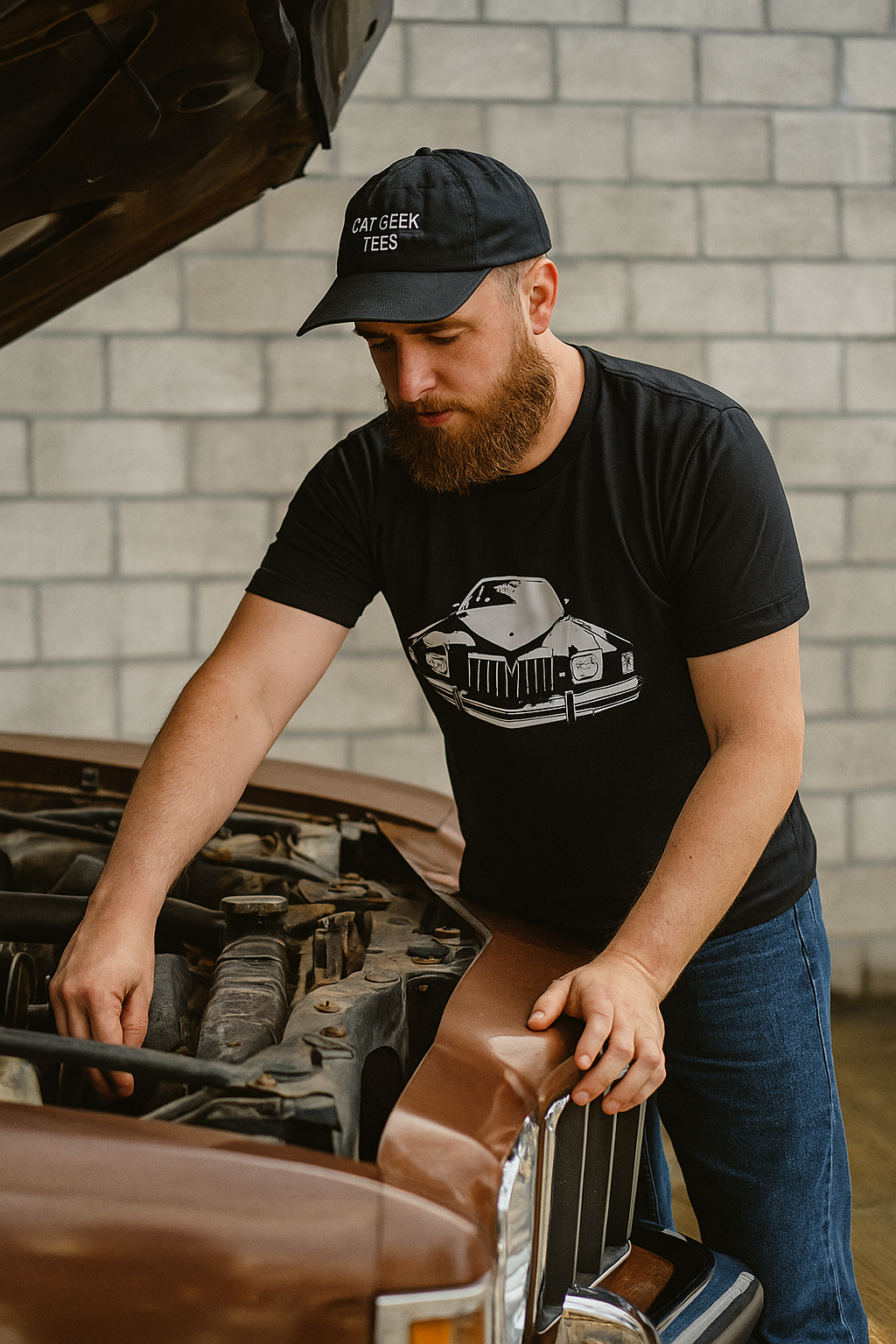 Man wearing a black cap and t-shirt with a graphic design, working on a car engine.
